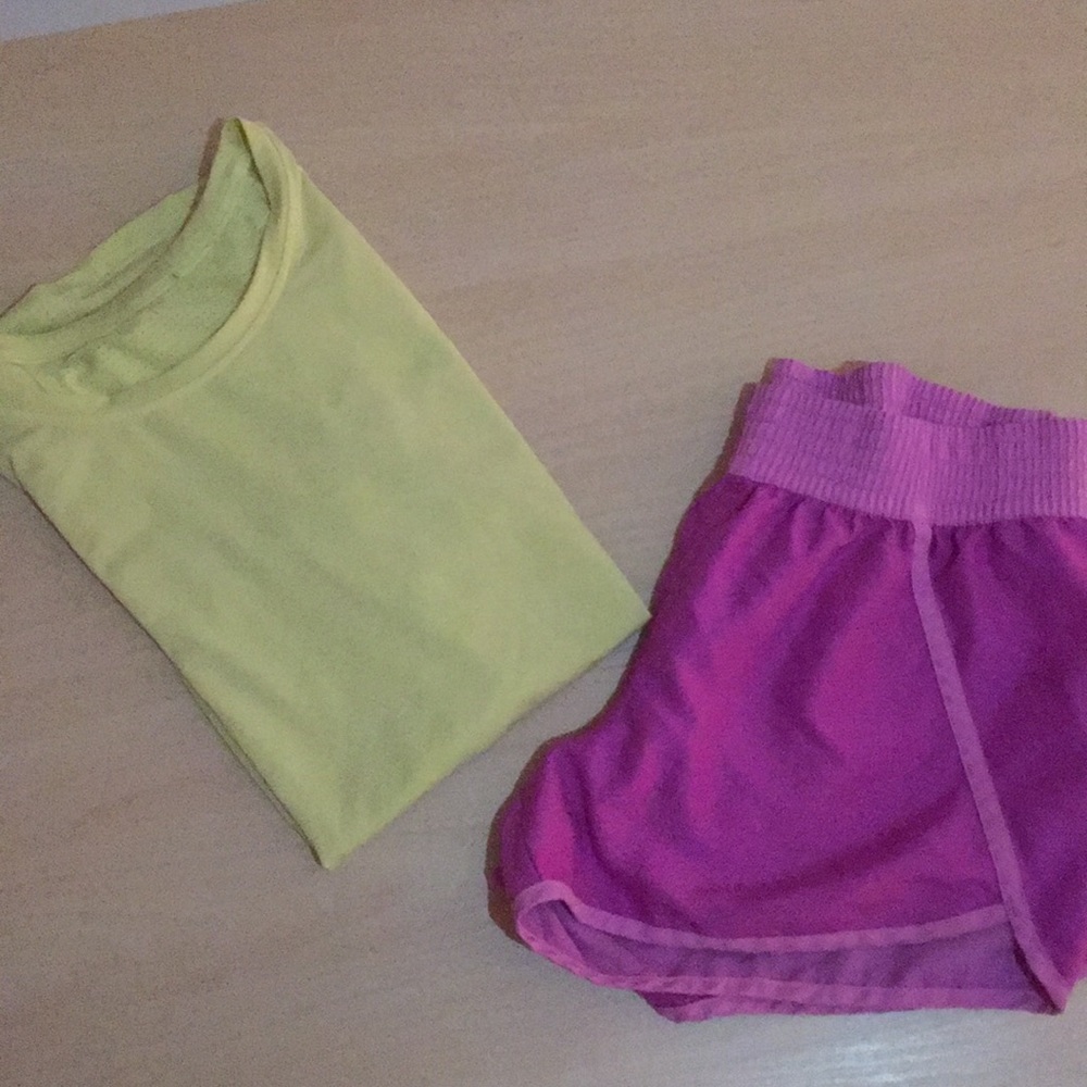 Kids yellow sport shirt and purple sport shorts.
